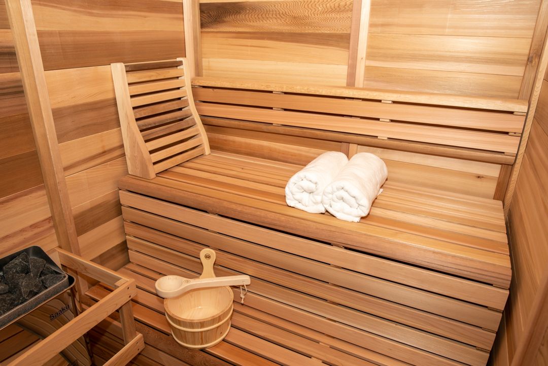Indoor sauna cedar benches with towels