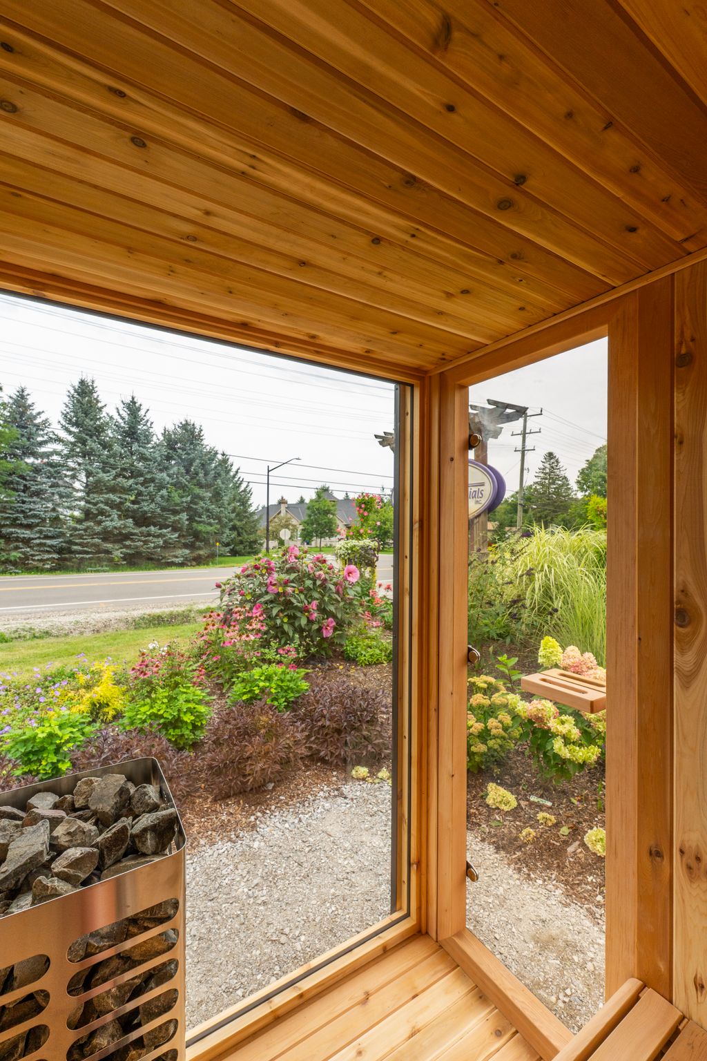 View of the garden through the Neptune Mini glass wall