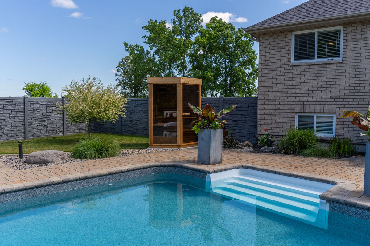 Trinity sauna beside a backyard pool