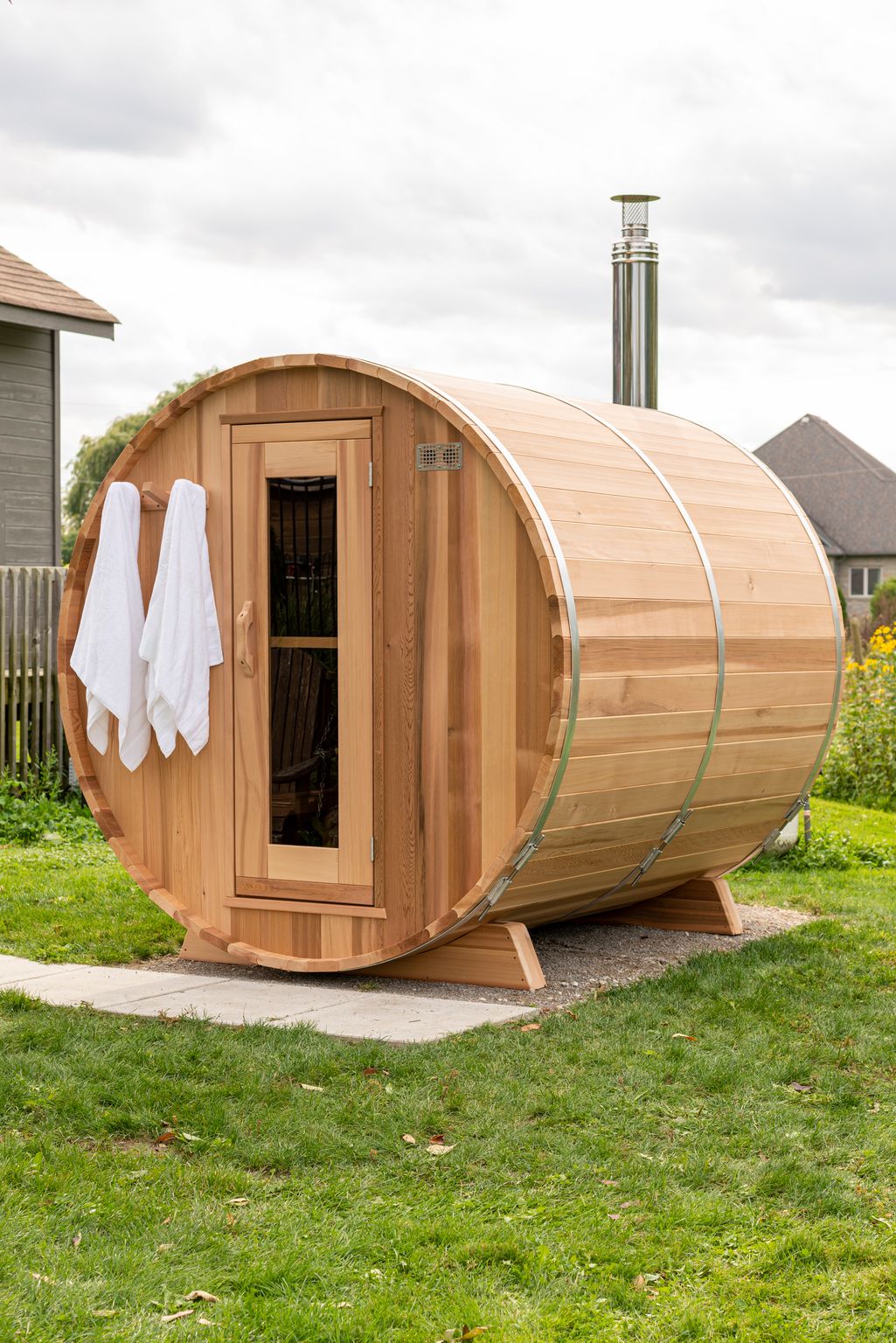 Clear red cedar barrel sauna with towels