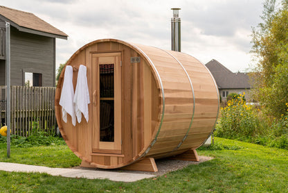Barrel sauna with wood-burning stove chimney
