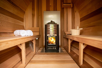 Barrel sauna interior with wood stove