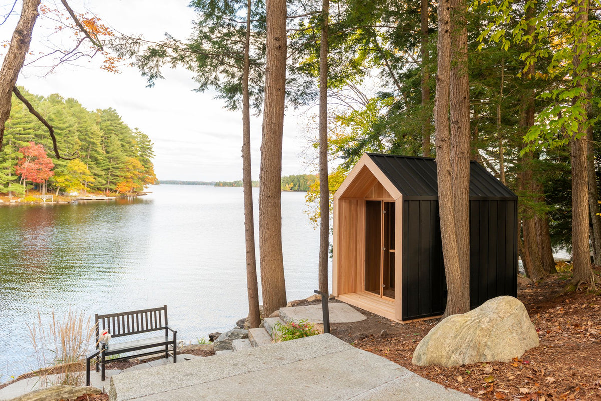 Hudson sauna among pine trees by the lake