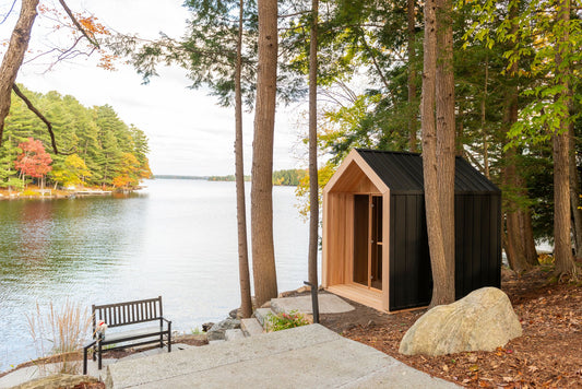 Hudson sauna among pine trees by the lake