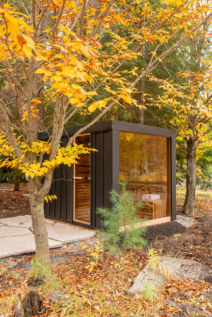 Neptune sauna full glass wall in a fall backyard