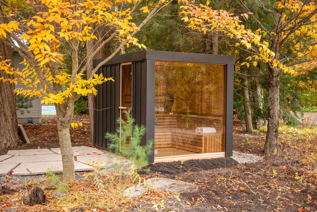 Neptune outdoor sauna on a stone patio