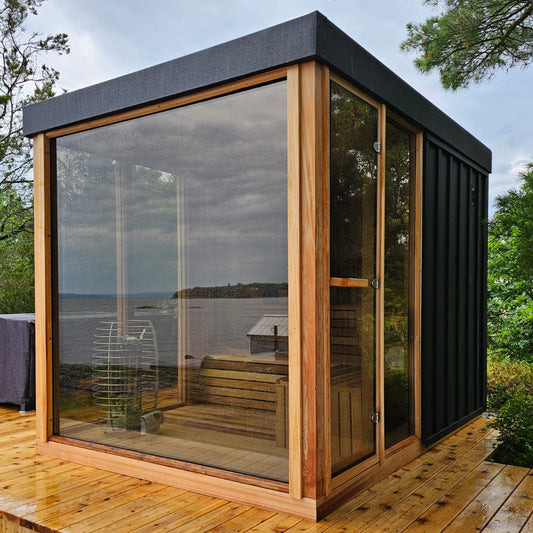 The Orion Sauna, a modern glass-front Canadian cedar outdoor sauna from Prestige Saunas