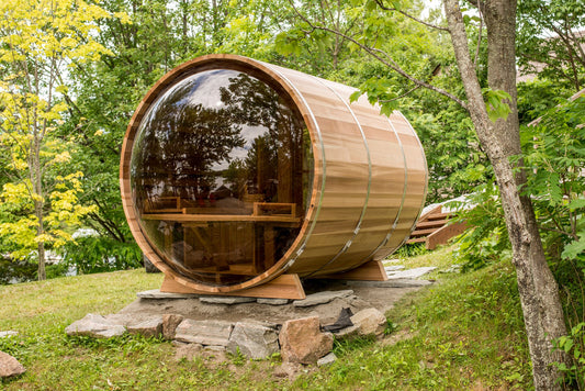 Panoramic barrel sauna on a wooded lot
