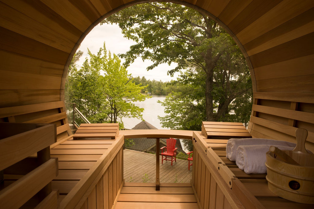 Lake view through the panoramic barrel sauna window